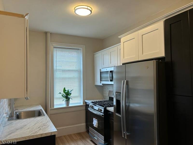 Welcome to this recently renovated and spacious 2 bedroom, 1 bath unit, filled with natural light and located right across from James J.
