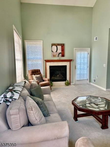 Welcome to this spacious and inviting townhouse featuring a desirable first floor primary suite and thoughtful layout.