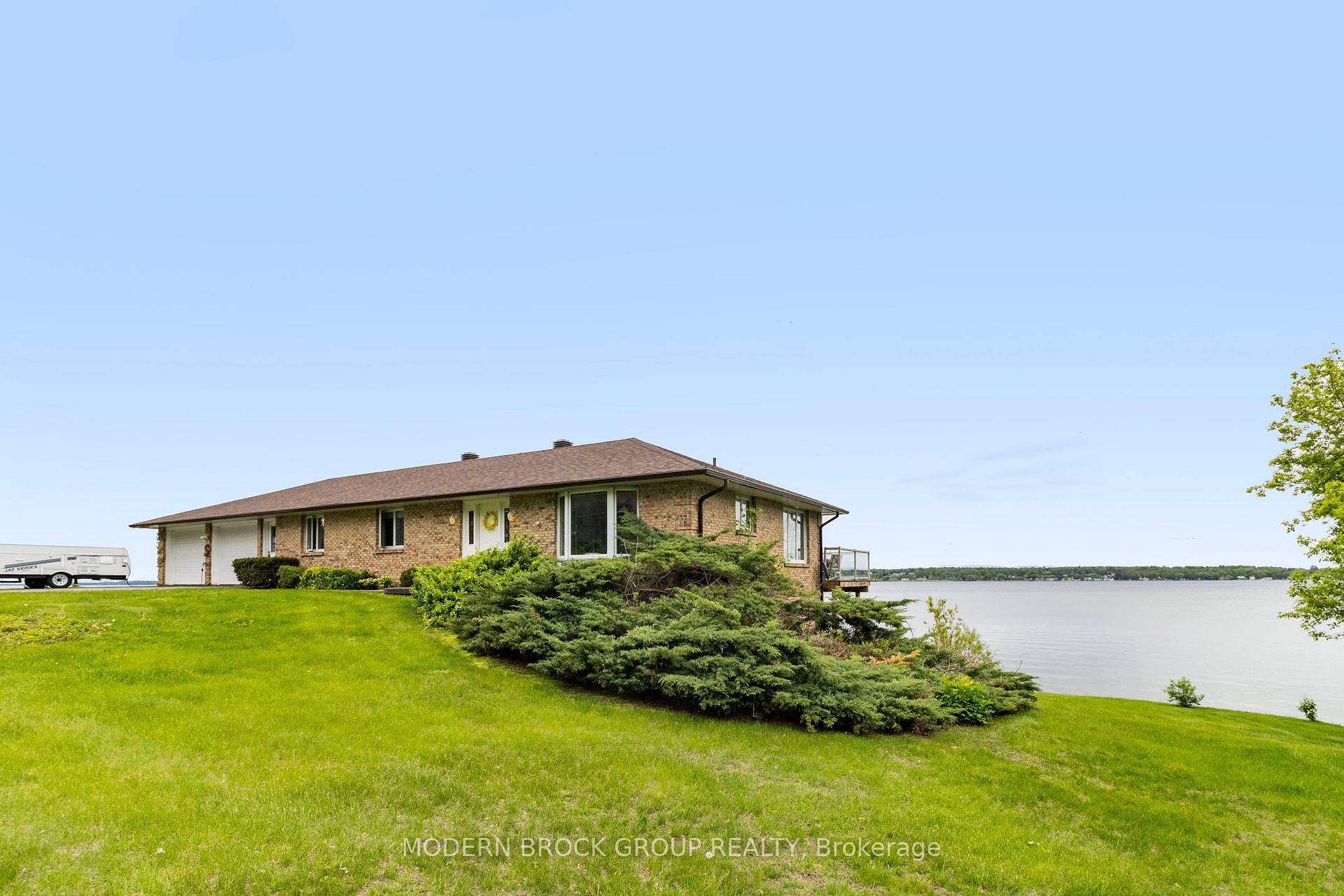 Welcome to 1563 County Rd 2 a beautifully maintained brick bungalow perched on the edge of the St.