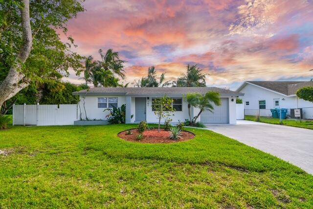 Welcome to this tastefully updated single family residence that perfectly captures the relaxed South Florida lifestyle while offering modern comfort and flexibility.