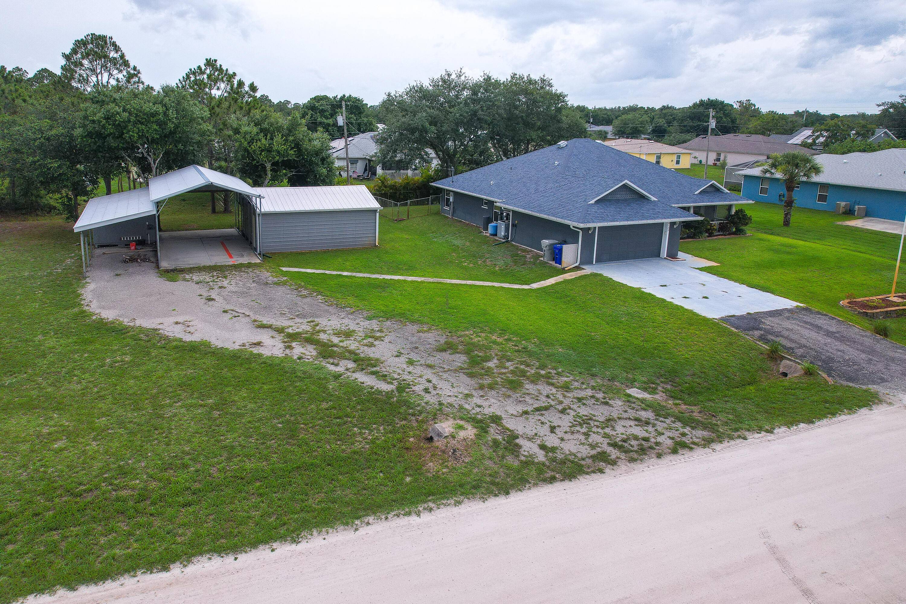 Welcome to your private country retreat in Vero Lake Estates an expansive 3 bedroom, 3 bath, 2 car garage home situated on three oversized lots.