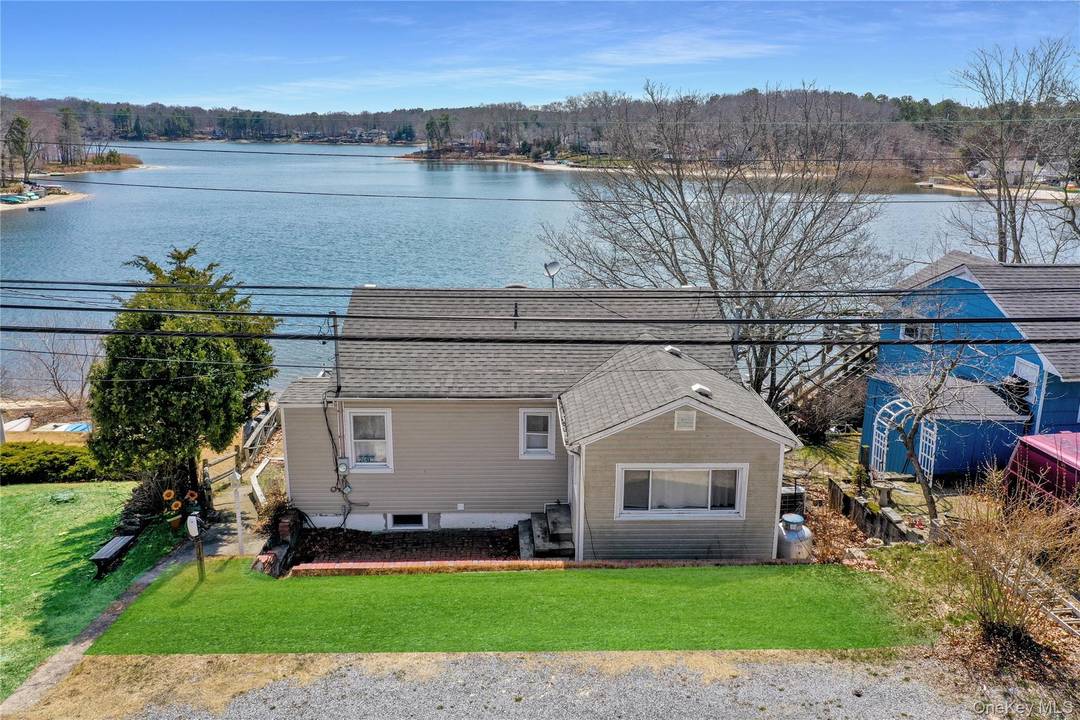 Experience Unparalleled Lakefront Living in this Recently Renovated Ranch nestled in the Highly Sought after Lake Panamoka Community.