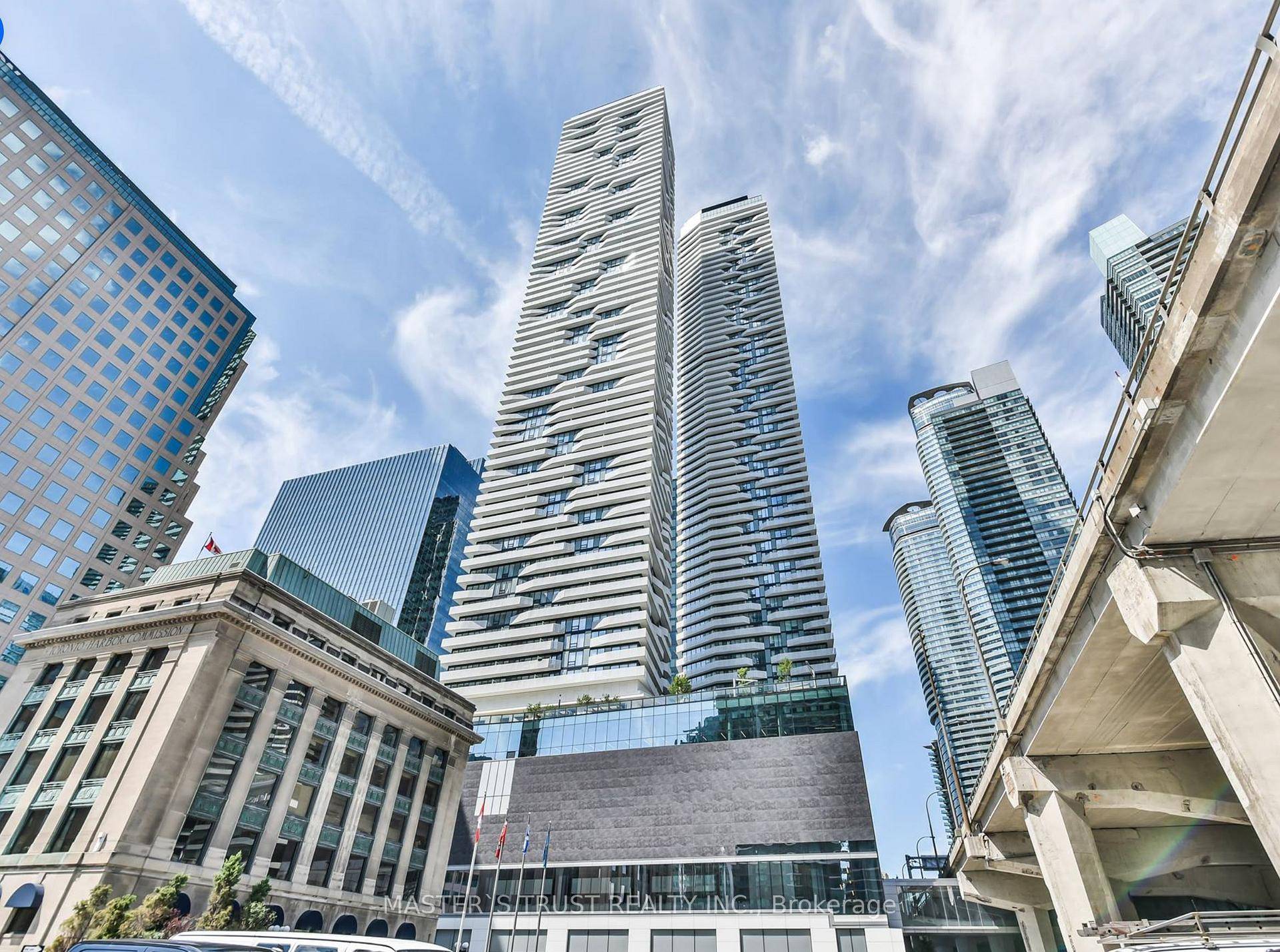 Welcome to this Stunning corner unit with wraparound balcony, offering panoramic lake views and city skyline by night.
