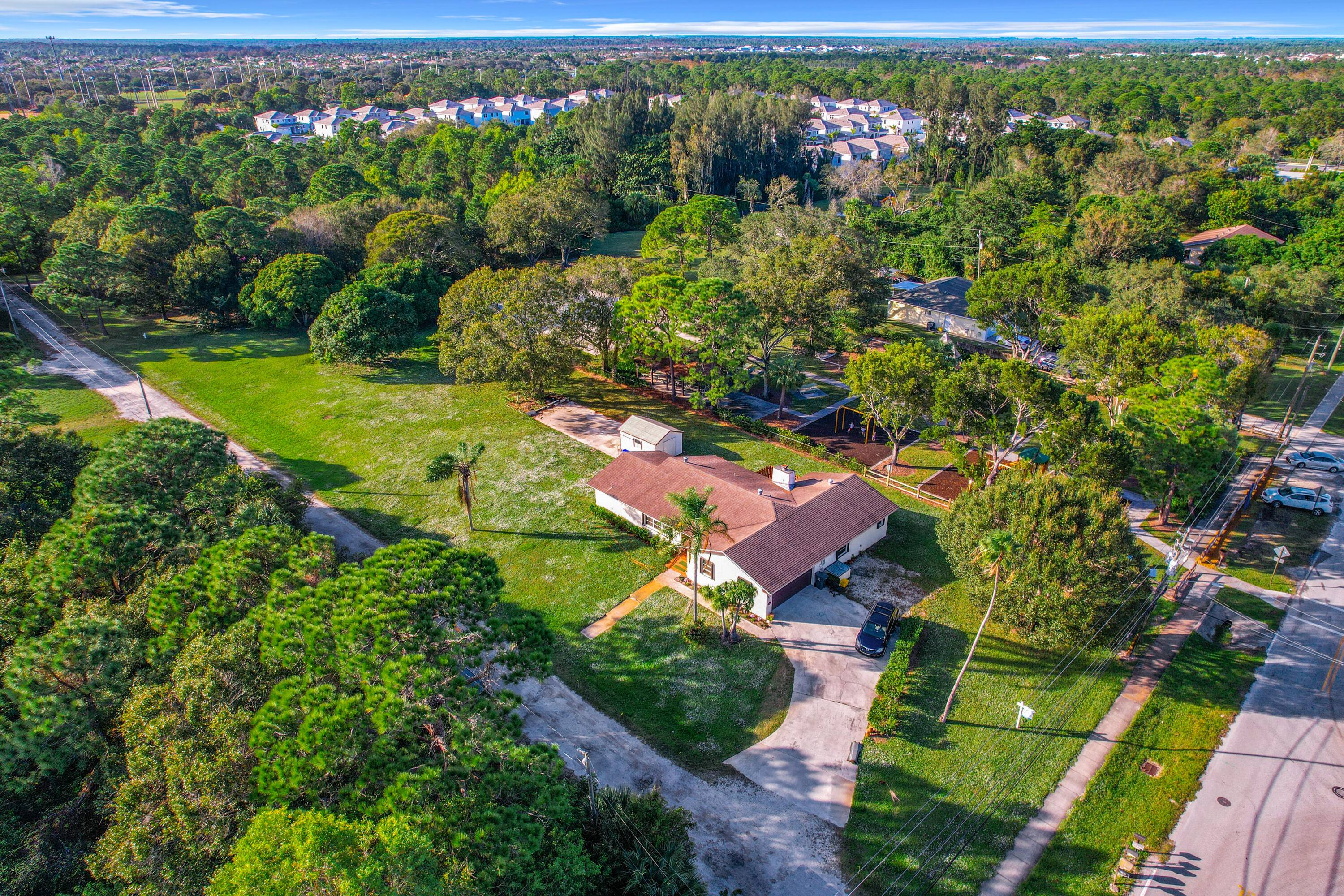 Exceptional investor opportunity on nearly an acre corner lot in Jupiter's coveted school district.