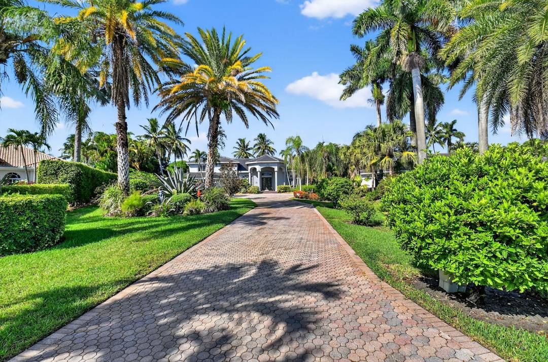 Gorgeous Mediterranean inspired estate home custom built and set on a sprawling one acre lot for added privacy.