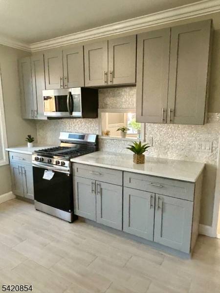 RIGHT HALF DUPLEX Stunningly renovated, offering four levels of living space !