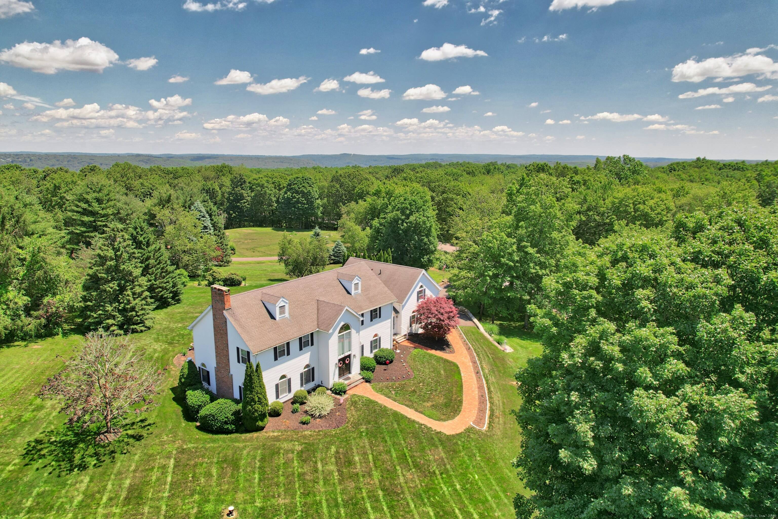 Welcome to this Majestic Colonial home, nestled on a picturesque 1.