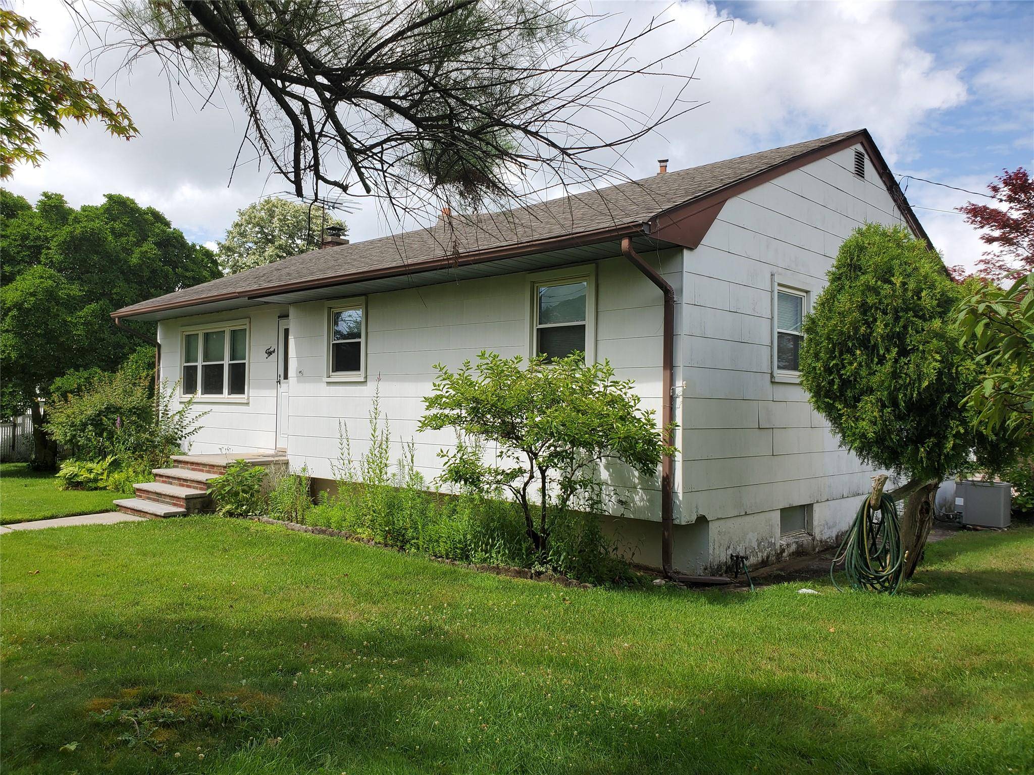 Welcome to your new home nestled on a quiet and spacious 1 4 acre corner lot in beautiful Rocky Point.
