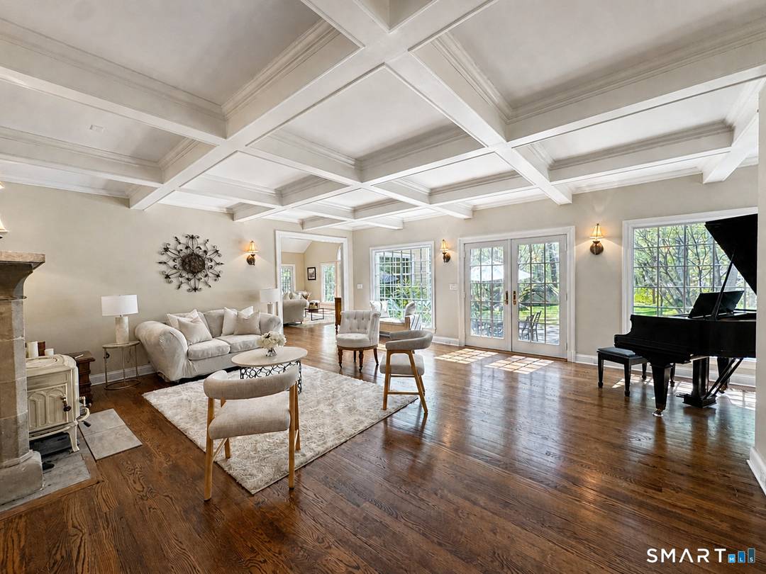 Beautifully rebuilt in 2006, this custom turn key retreat offers 4 spacious Bedrooms with the flexibility for a 5th, 3 full 2 half baths, all set on 2.