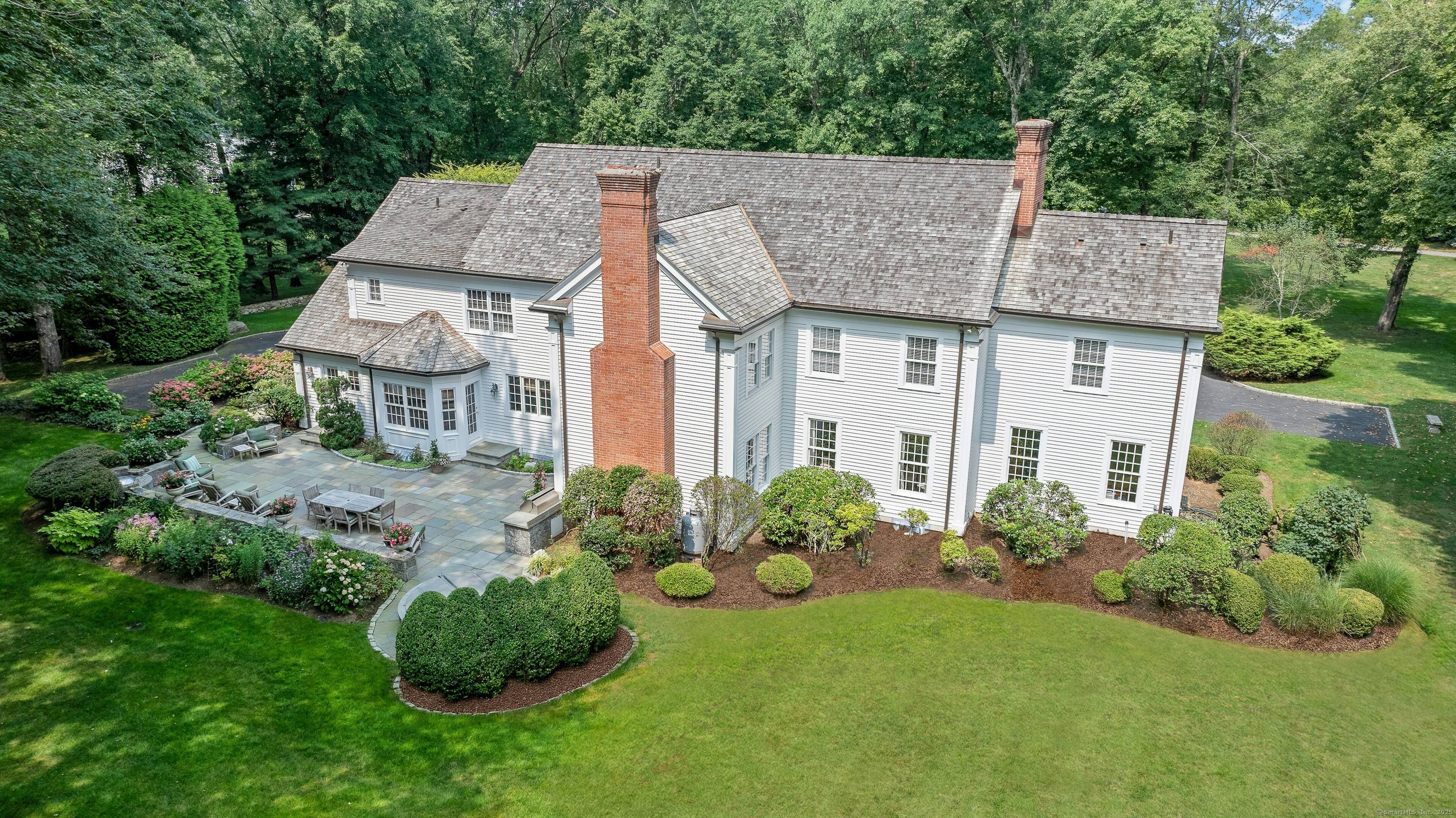 A stately approach evokes the grandeur of this elegant five bedroom Colonial.