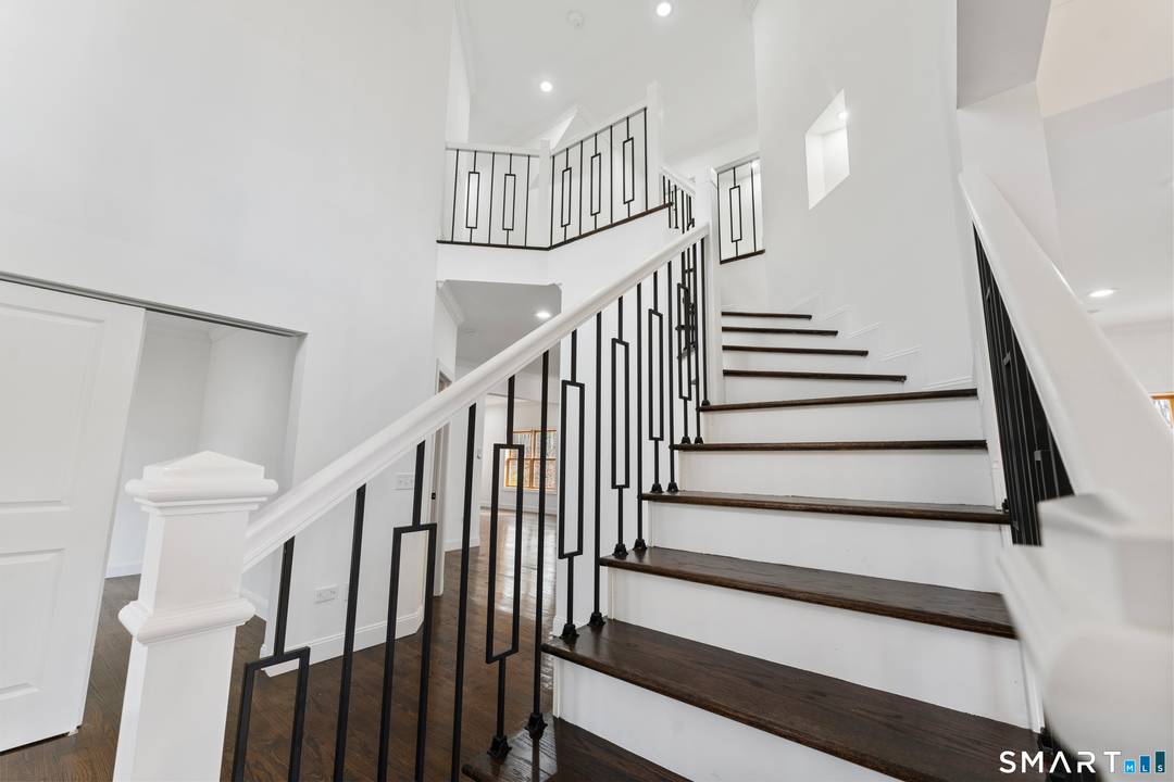 SPRAWLING custom contemporary offers nearly 3, 500 SQFT of well appointed living space with a modern design.