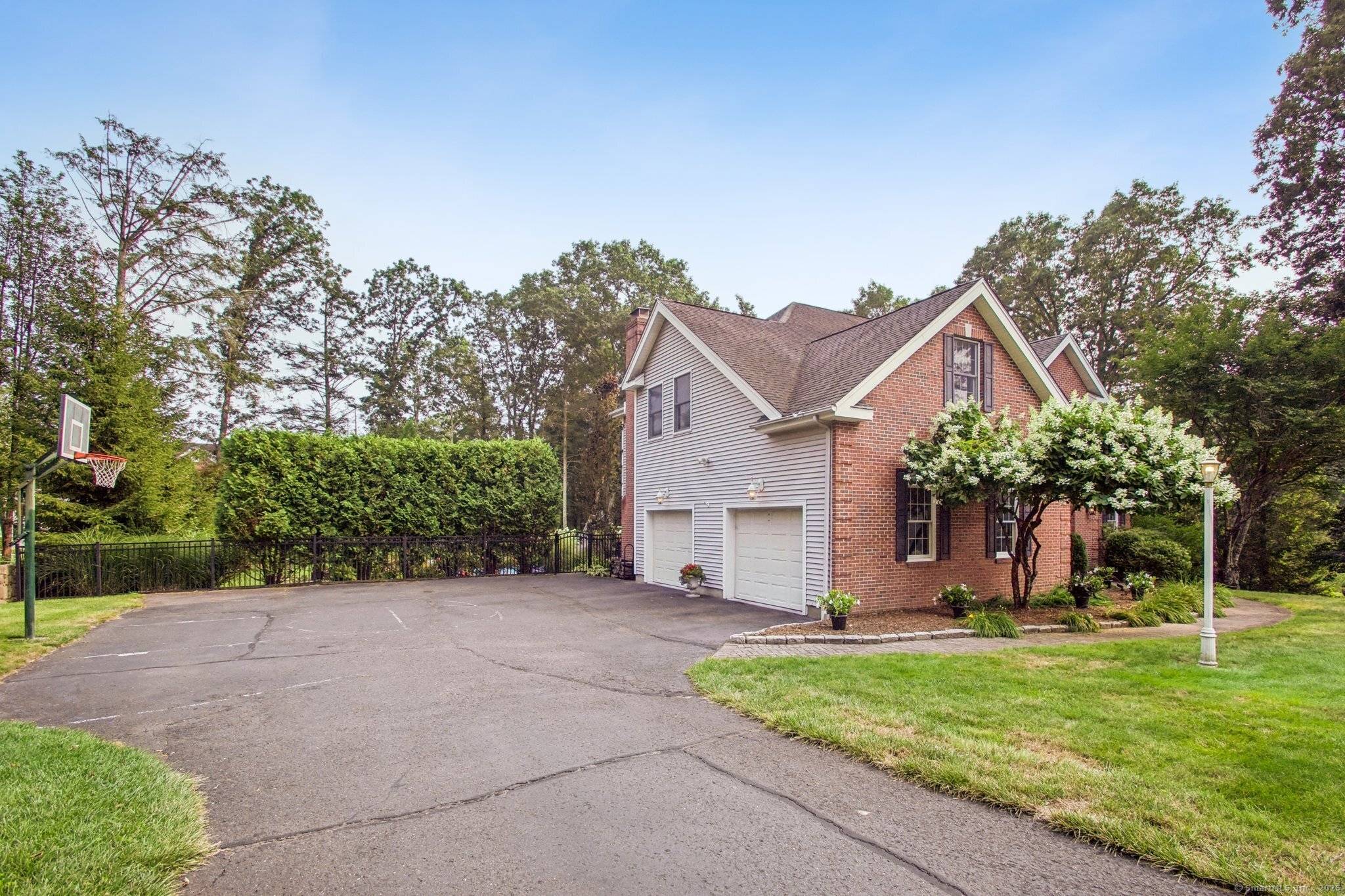 Welcome to 40 Pleasant Drive, Southbury, CT, a picturesque Colonial nestled in a peaceful, tree lined neighborhood.