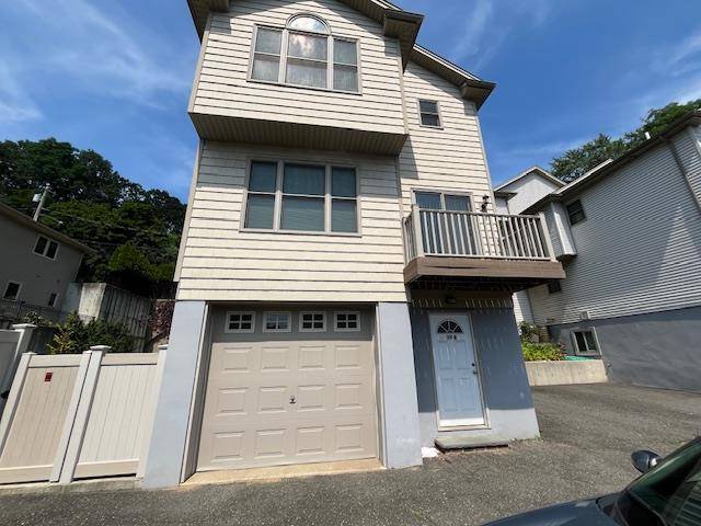 Spacious 2 Bedroom Apartment with Rear Entrance and Garage.