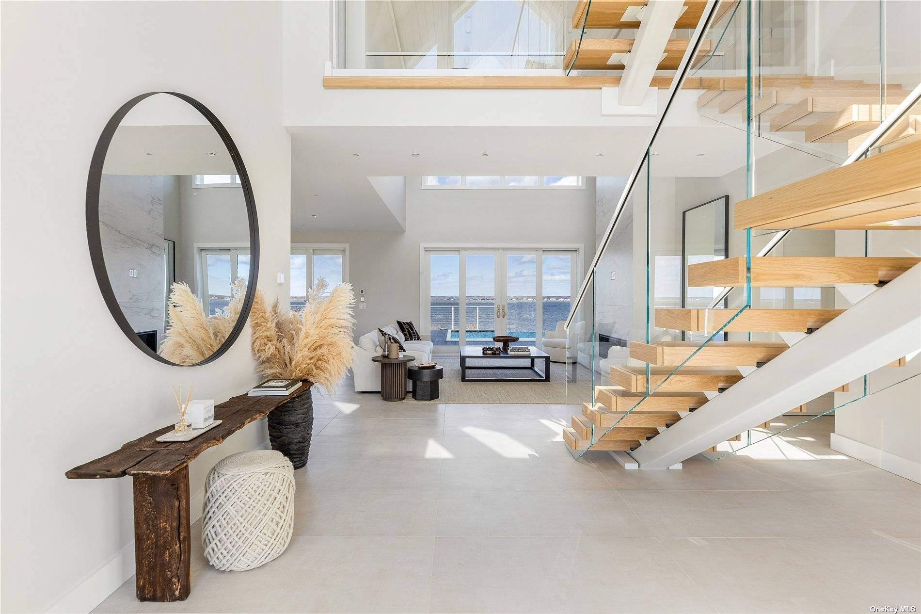 Transcending the notion of a mere home with an exquisite blend of timeless design and contemporary elegance, this newly constructed Nordic Modern Beach Home by First Dunes stands as a ...
