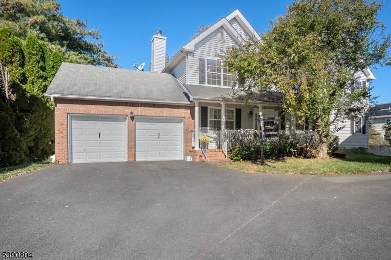 Welcome to this beautiful 1833 sq ft Southeast facing home featuring a covered front porch and a decorative entry door that sets the stage for what's inside.