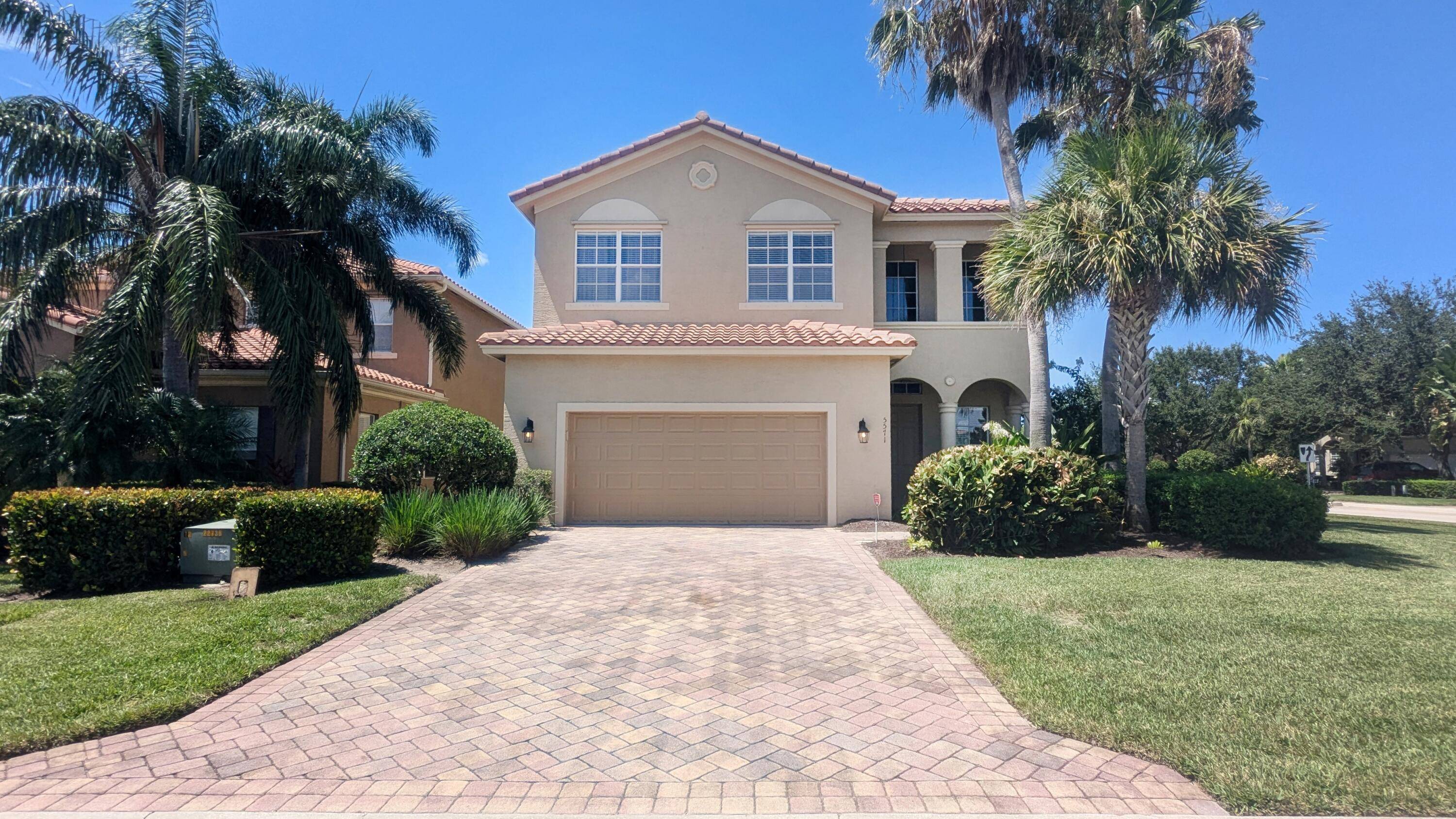 stunning home situated on a spacious corner lot in one of Vero Beach's most desirable gated communities.