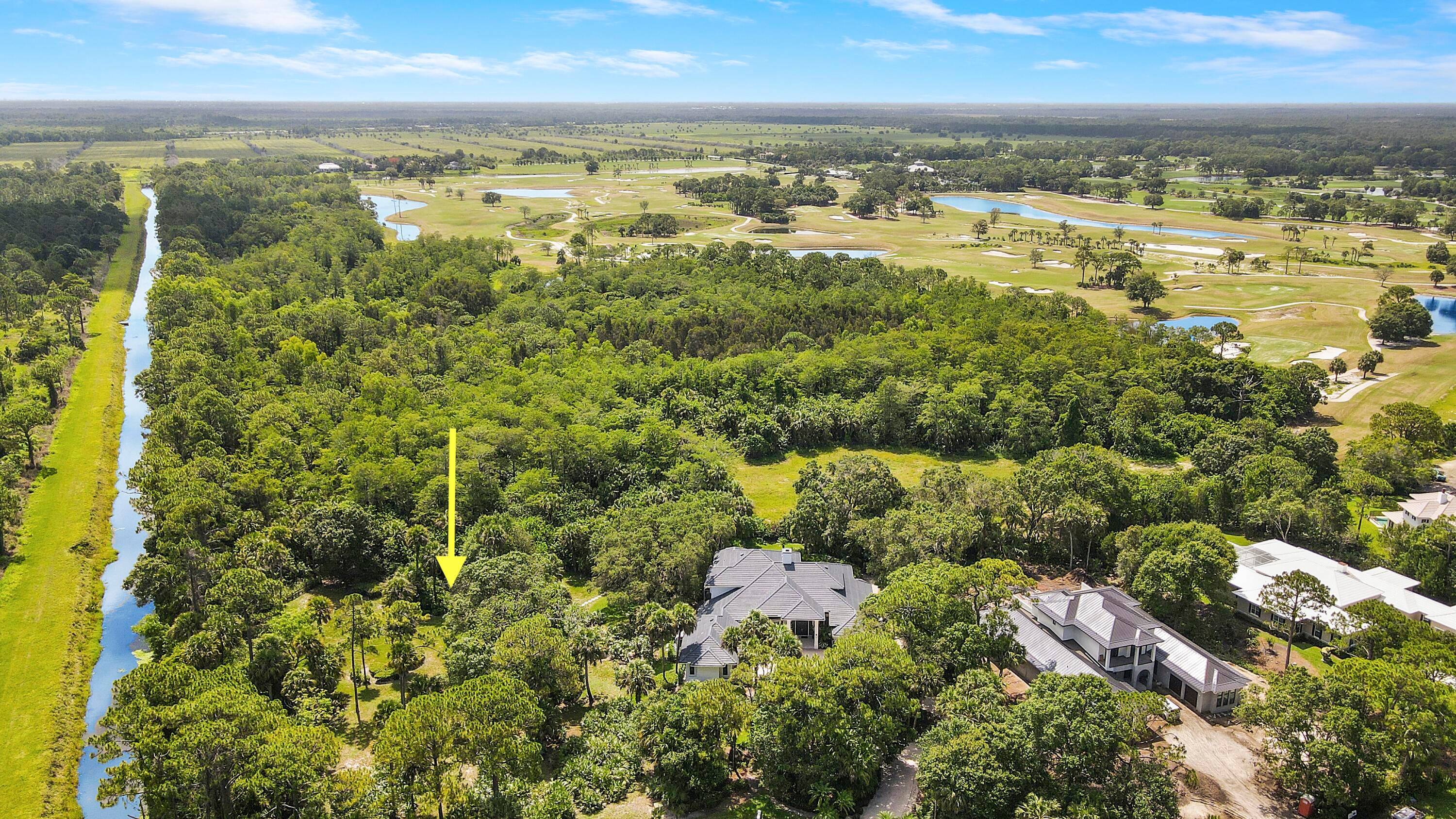 This exceptional lot, located at the end of a quiet street, offers unparalleled privacy and a rare opportunity to build your dream home in a natural paradise.