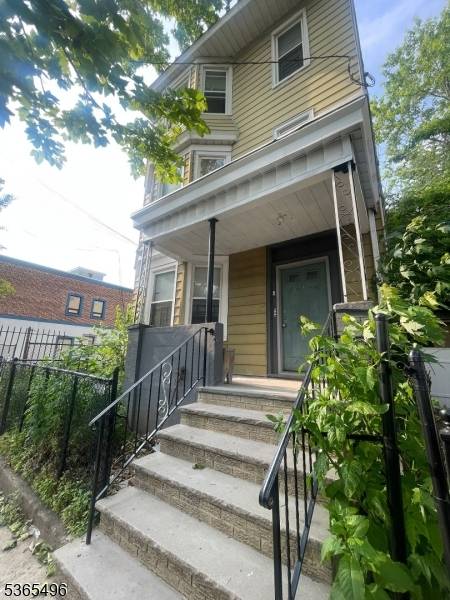 Opportunity knocks with this solid 3 family home perfectly situated in the heart of Newark.