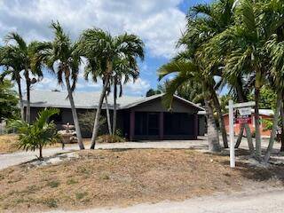 This spacious property at 455 Janice Ave located in South Bay, Florida sits on 0.