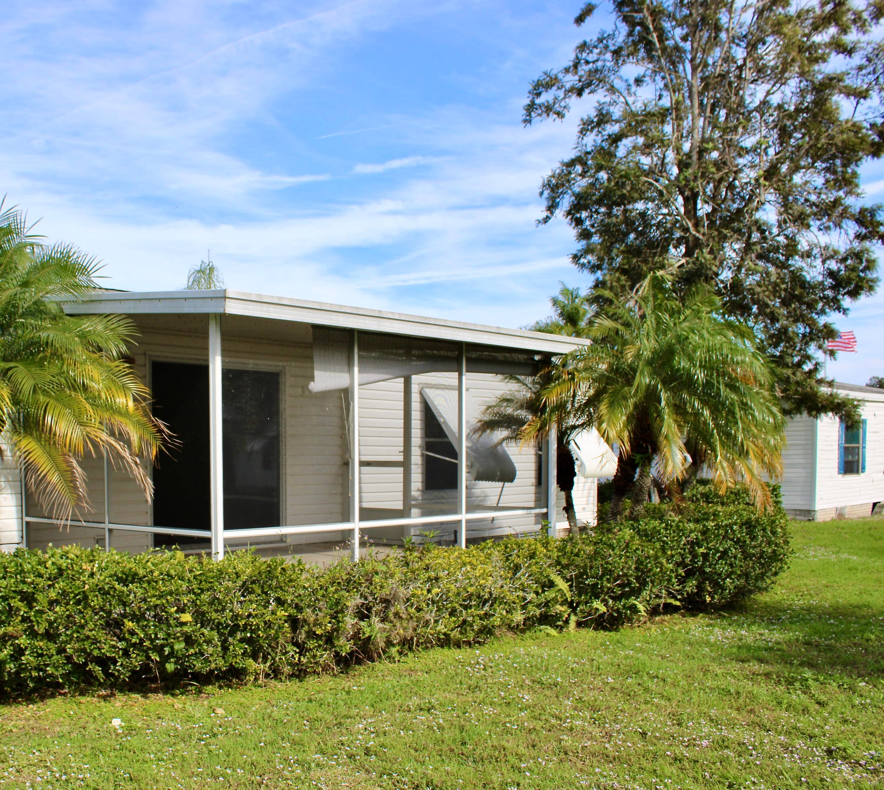 Discover the potential in this 2 bed, 2 bath home in the sought after 55 community of Tropical Isles, Fort Pierce !