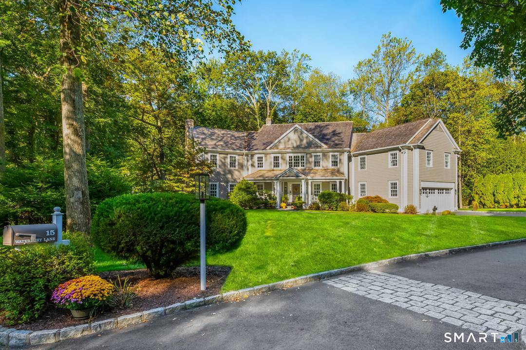 Tucked away on a quiet private cul de sac, 15 Waterbury Lane offers exceptional privacy on a beautiful one acre property in the heart of Darien.