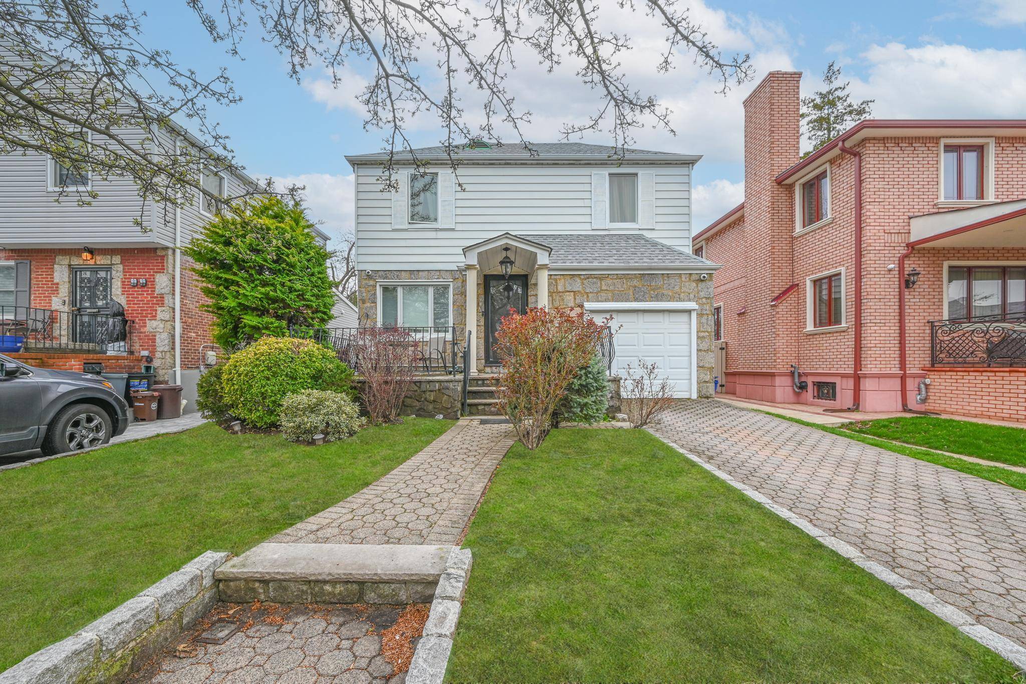 Welcome to this elegant residence in the heart of Jamaica Estates.