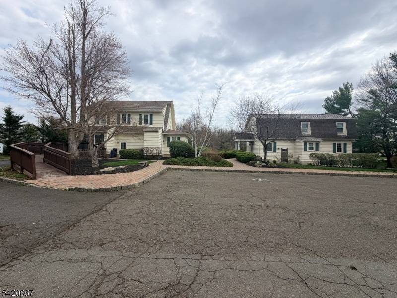 Prime location ! Two commercial buildings on one lot with a shared private parking lot.