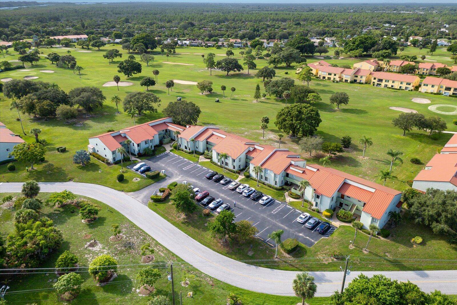 Enjoy peaceful views of the 14th fairway at Miles Grant Golf Course right from your living room or sun filled bonus room.