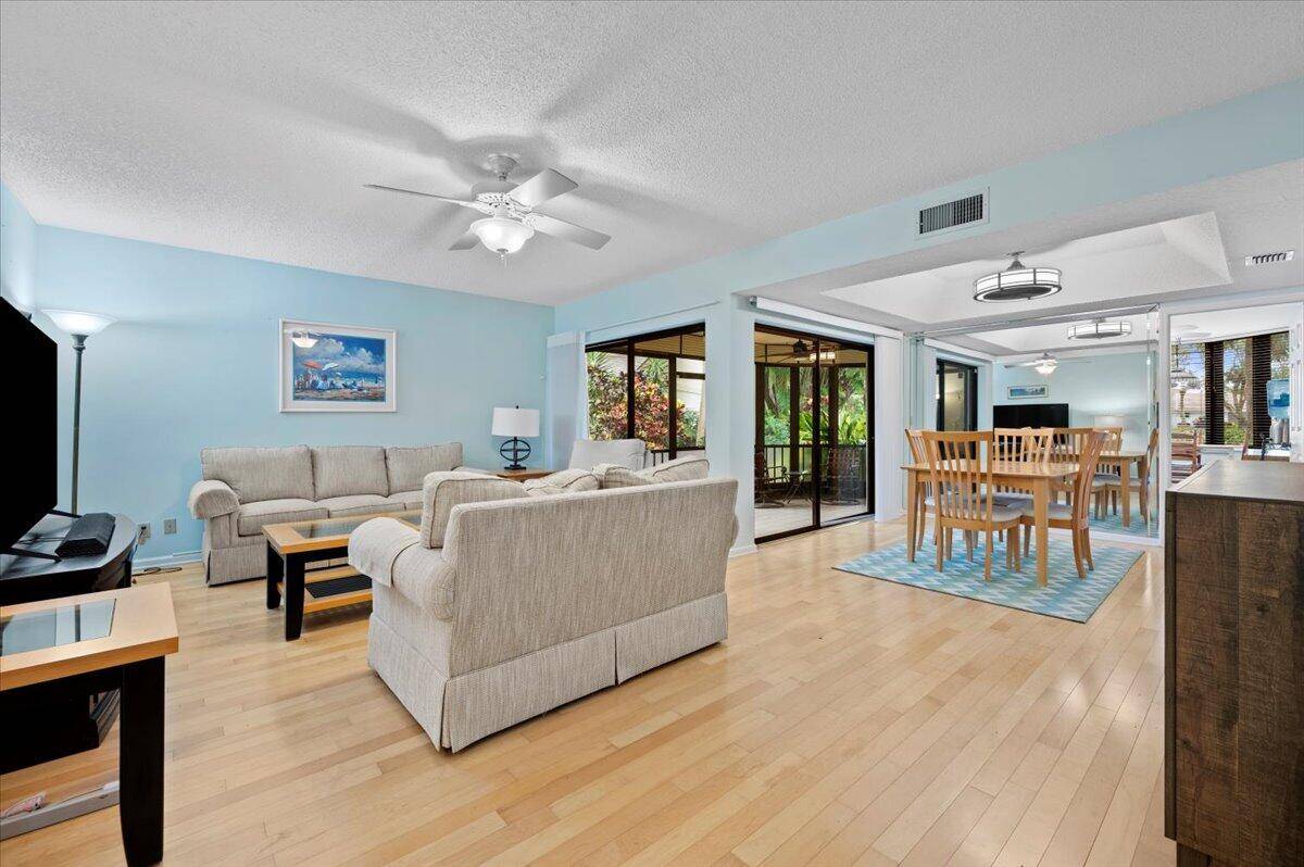 Welcome to your dream home at 16942 Waterbend Drive, Unit 155, nestled in the beautiful golf course community of Jonathan's Landing in Jupiter, FL !