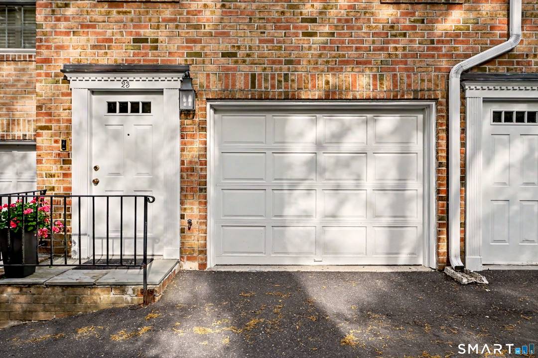 Tucked away in a private, tree lined complex with a peaceful wooded setting, this updated Georgian style townhouse offers comfort, convenience, and outstanding commuter access.
