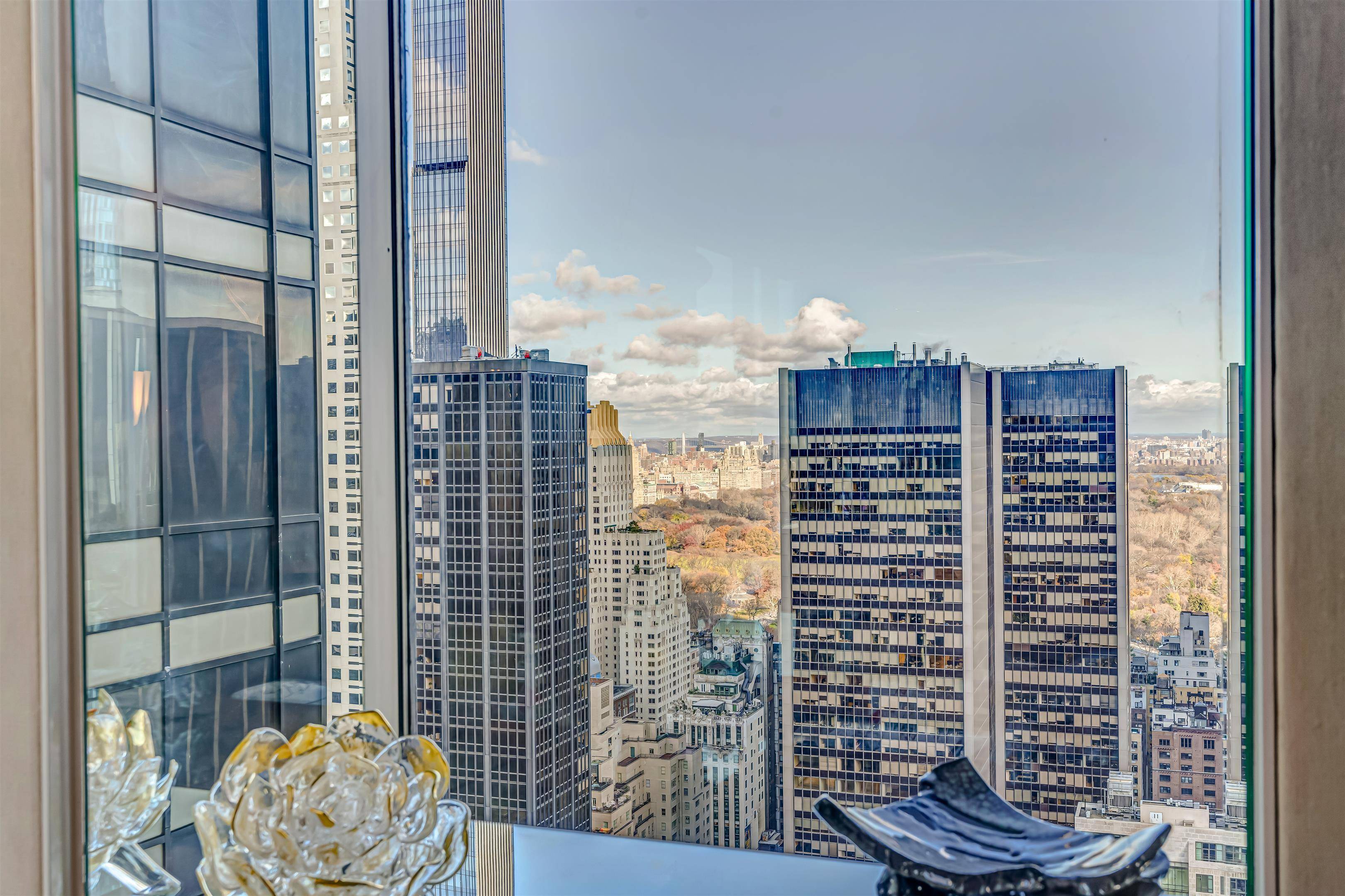 Overflowing with chic and clever design, this oversize 1 bedroom corner condo offers prime views of Central Park, the skyline, and Manhattans glittering evening lights.