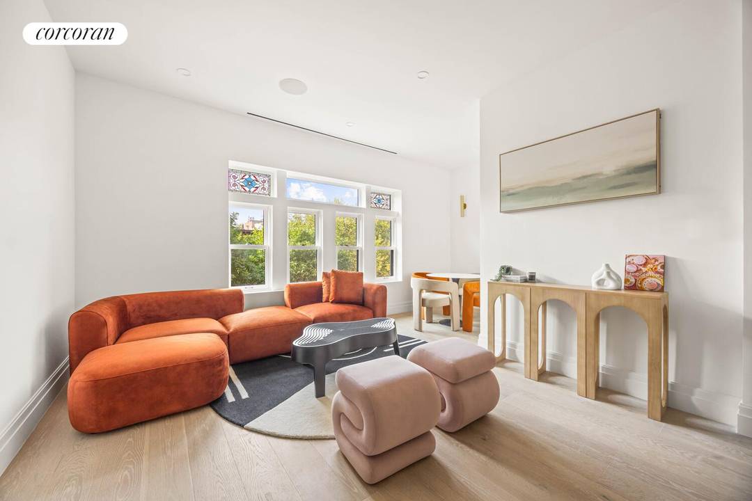 Perched on the top two floors of this historic Brownstone, a spacious 1, 108 sqft, three bedroom, two bathroom duplex condo with a private terrace, set in a newly converted ...