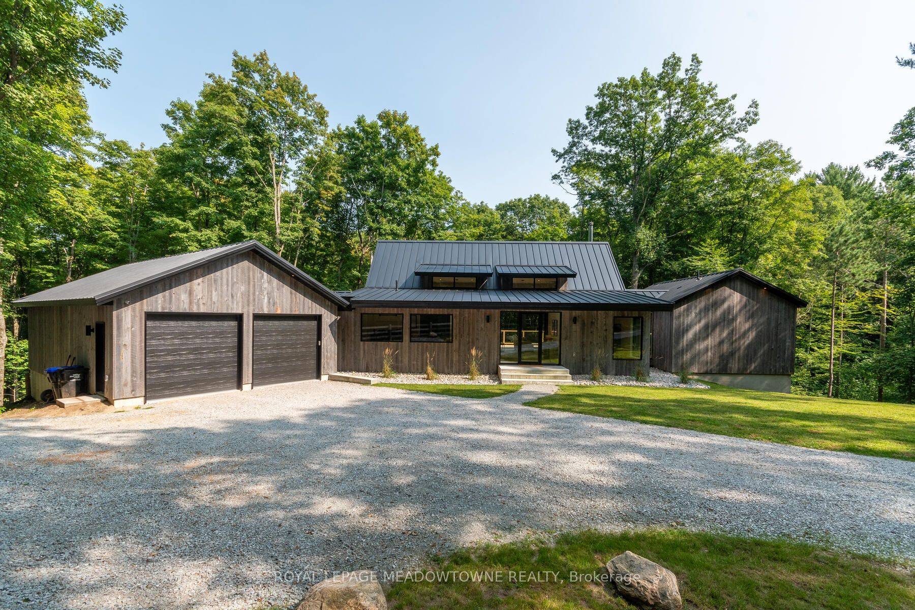 Unparalleled Craftsmanship Tucked Away on Almost 10 Wooded Acres Overlooking Your Private Ravine and 2km Hiking Trail.