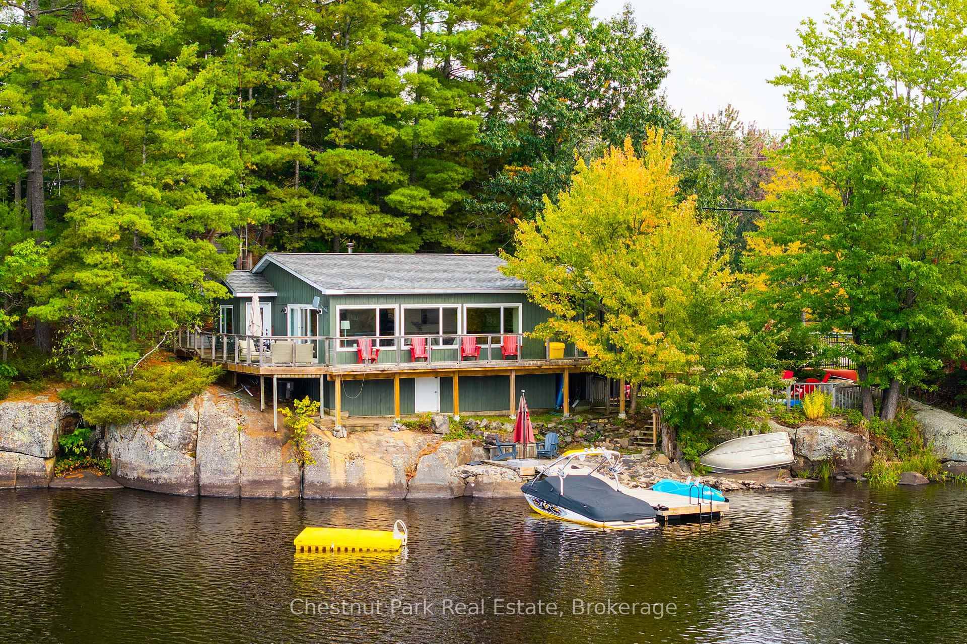 Perched atop a magnificent granite outcropping in the heart of Muskoka, this exceptional, fully winterized cottage or year round residence embodies the essence of refined lakeside living.