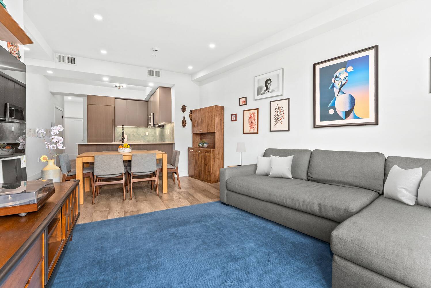 Welcome to this stunning full floor, three bedroom two bath duplex, crowned with an unmatched private rooftop spanning the entire building.