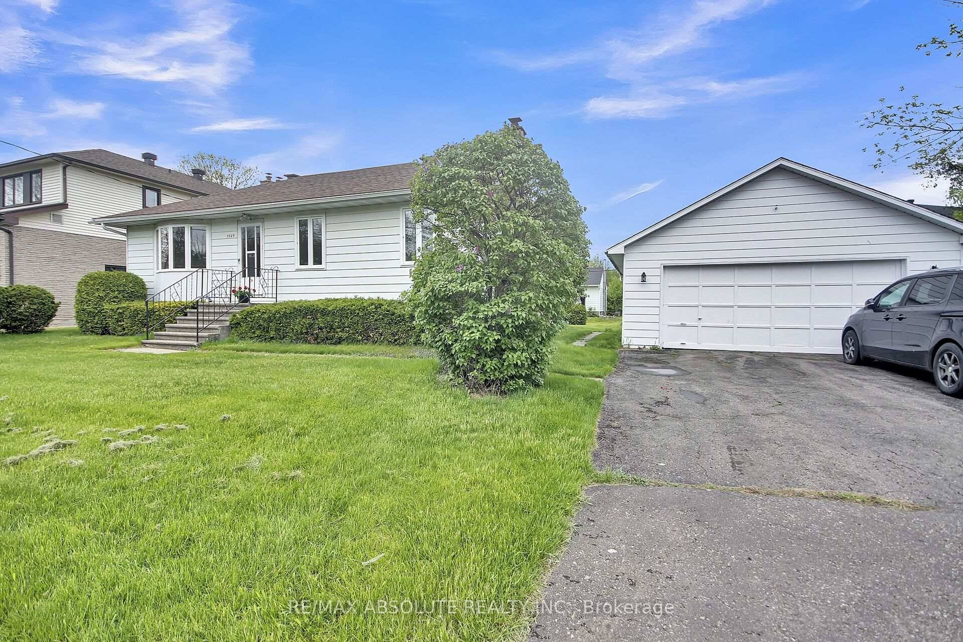 Charming Bungalow on Expansive Lot with Endless Potential.