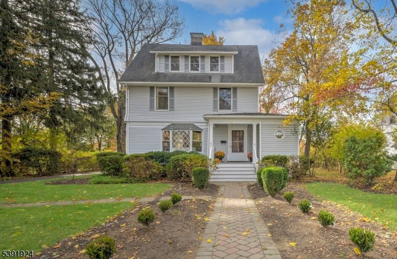 Sitting on the best lot along The Most Desirable Street in Town, this American Classic Colonial offers the perfect blend of timeless charm and modern comfort.