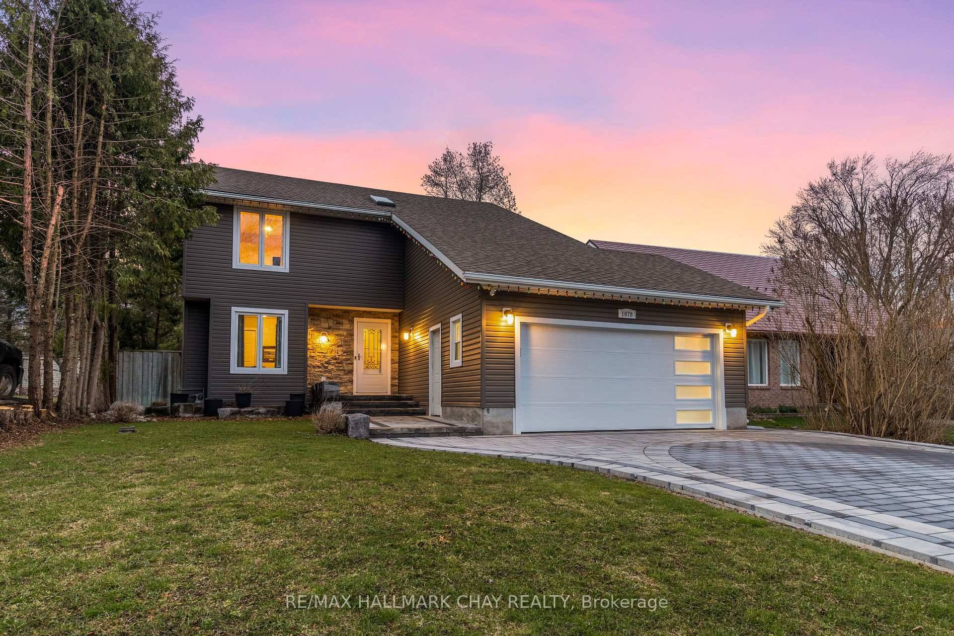 A short walk from the shores of Lake Simcoe, you will find this charming family home sitting on an expansive, private lot !