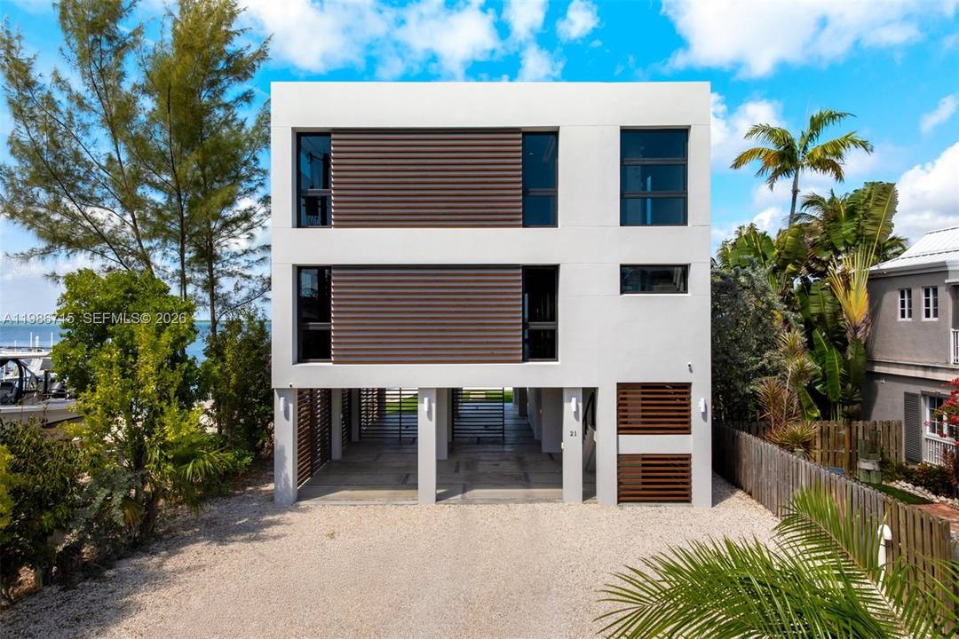 Modern bayfront residence in Key Largo, where minimalist architecture meets the natural beauty of the Florida Keys just 45 minutes from Miami.
