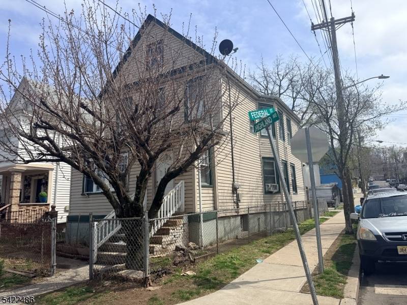 Great, well maintained two family house located in a nice corner and featuring two bedrooms, an eat in kitchen, a living room, and a bathroom on each floor.