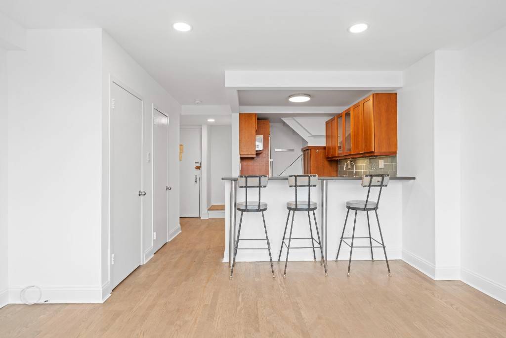 Stunning renovated, corner penthouse duplex in Astor Place with an expansive private terrace and panoramic unobstructed views of Manhattan and Brooklyn.