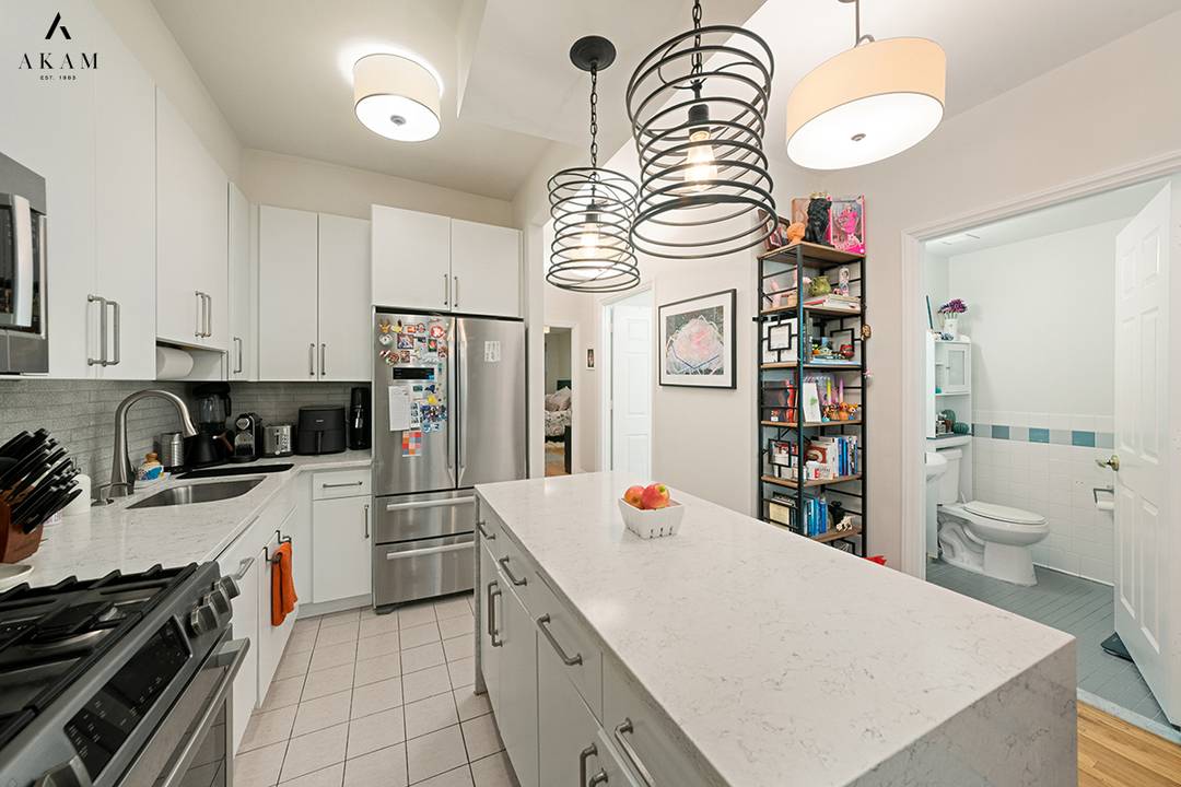 Located in a beautiful and historic, 1909 brownstone, this two bedroom, one and a half bath condominium effortlessly blends classic charm with modern comforts.