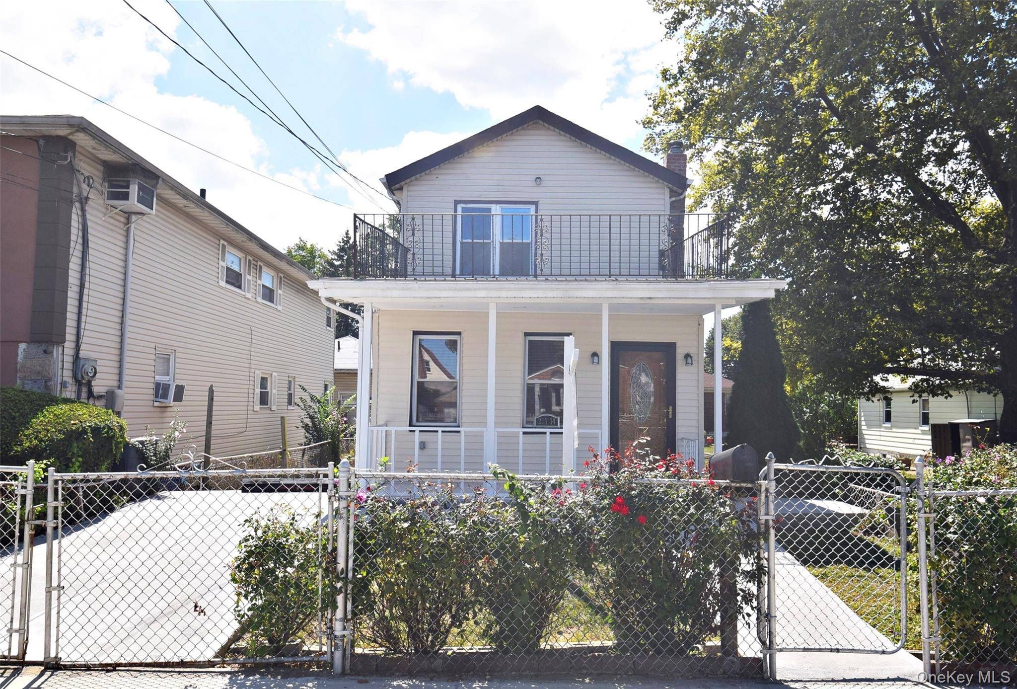 Welcome to 227 34 112th Road, a beautifully renovated single family home offering 4 spacious bedrooms and 2.