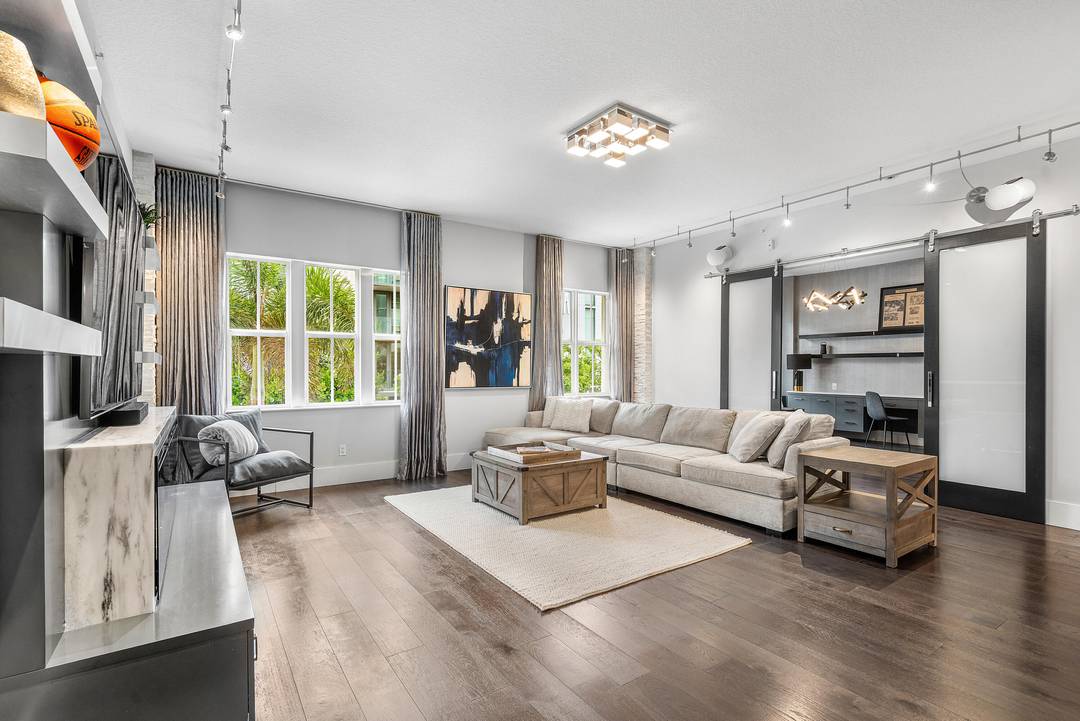 Discover this stunning 2 bed, 2 bath condo in Pineapple Grove's most prestigious building, just 2 blocks from Atlantic Ave and 10 blocks from the beach.