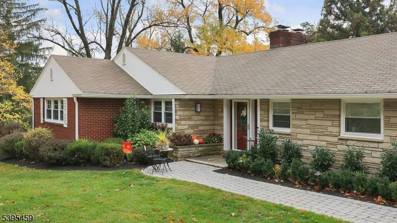 Meticulously maintained updated 5 bedroom, 4 bath ranch on 1.