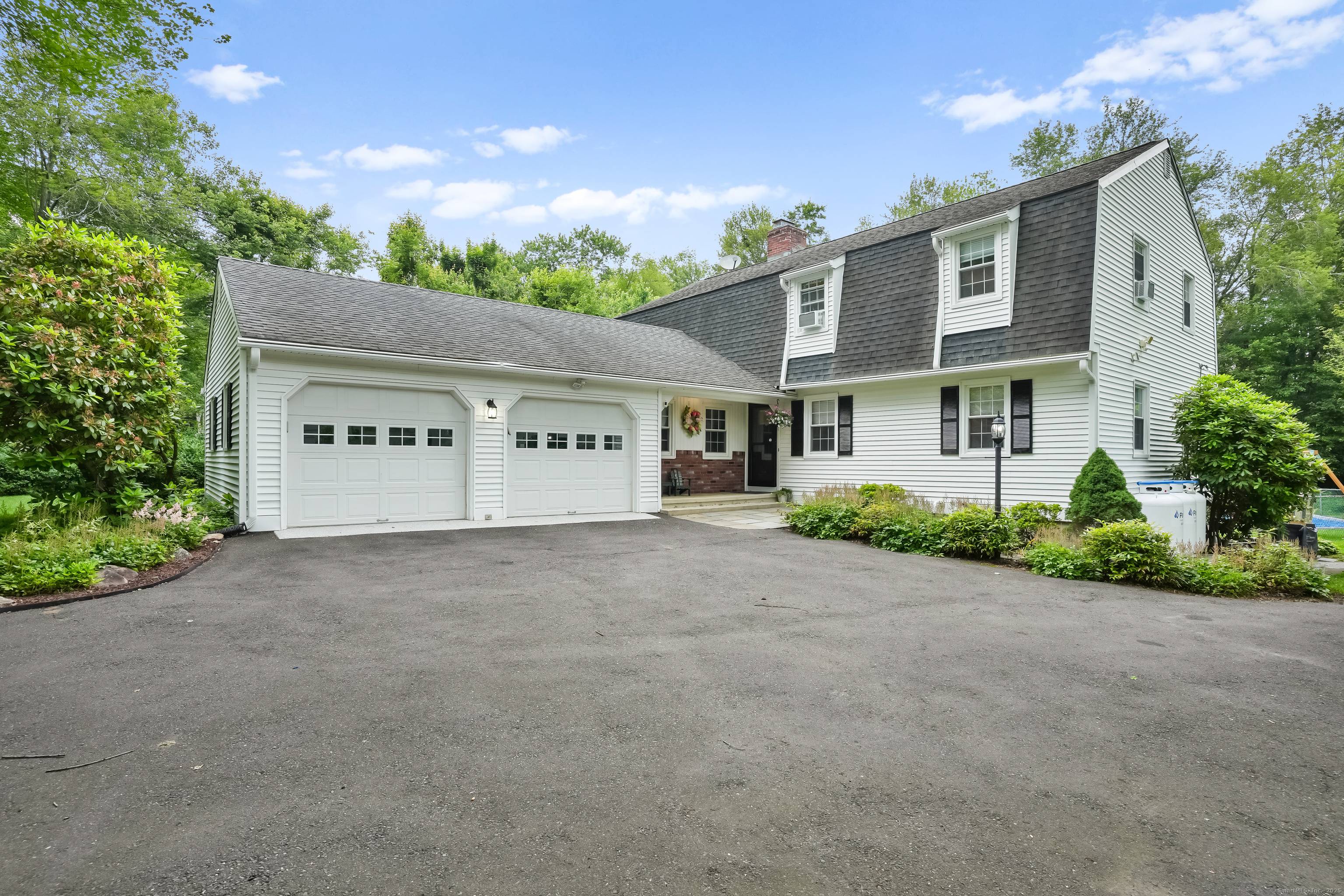 Captivating Colonial Home with Heated Saltwater Pool, Sunroom, and NEW Heating System !