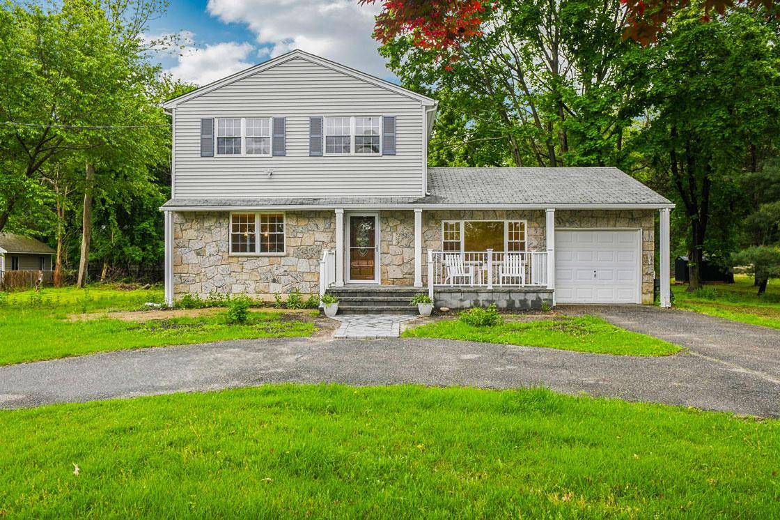 Step into this beautiful, tastefully renovated Center Hall Colonial, nestled in the desirable Swezeytown section of Middle Island.