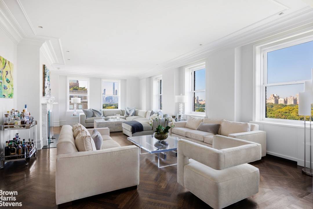 Located on Fifth Avenue's Museum Mile, this penthouse duplex boasts panoramic views of Central Park, the reservoir, and dramatic skyline views to Midtown Manhattan and beyond !