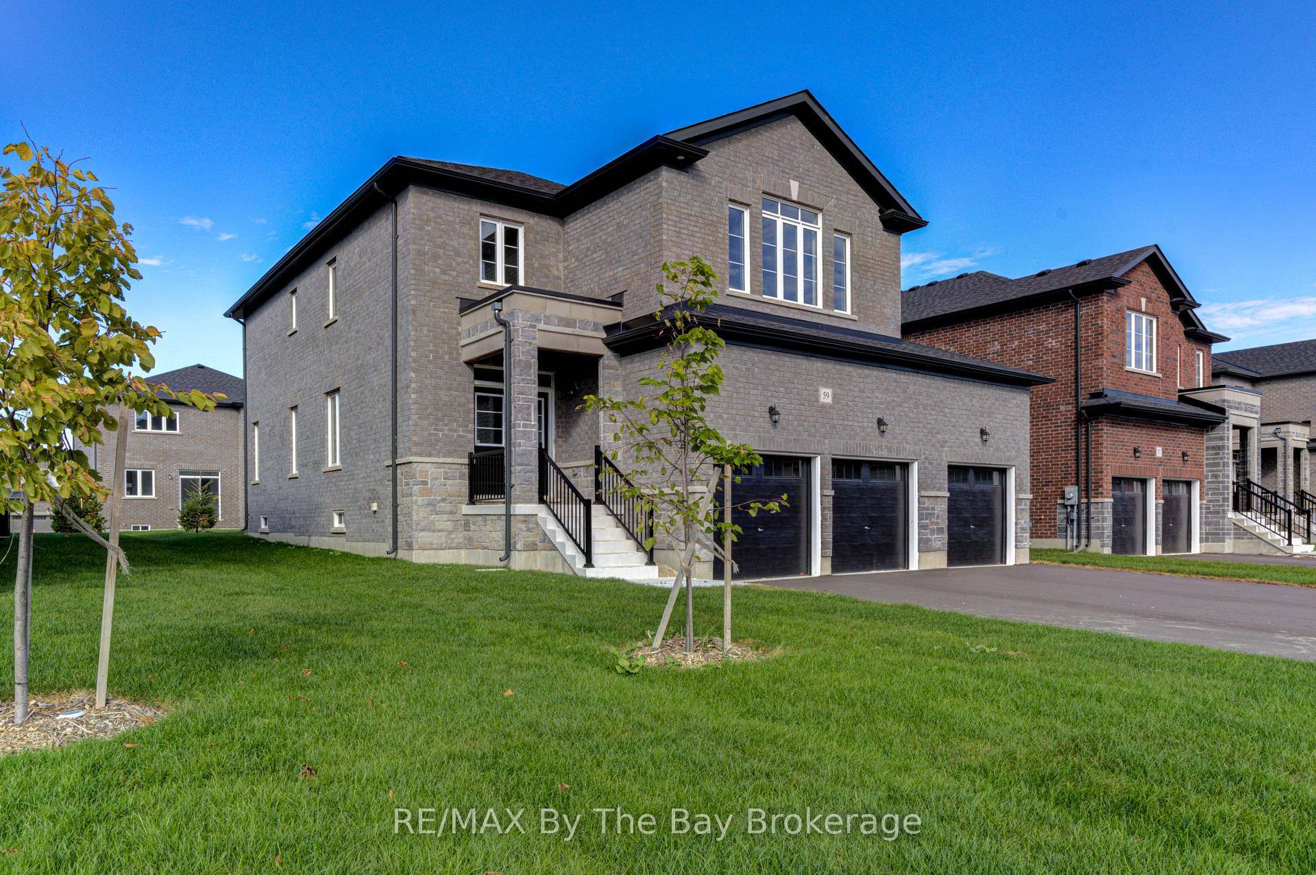 Welcome to 59 Amber Drive, boasting all Brick amp ; Stone home with triple car garage.