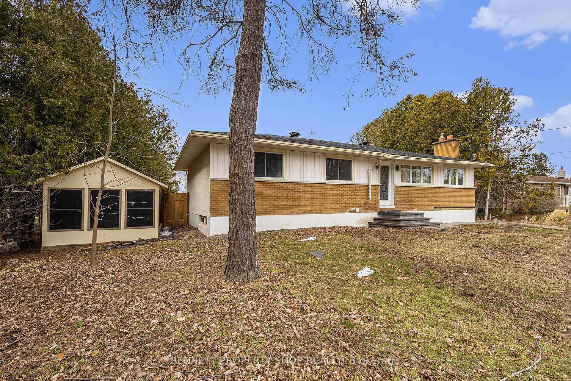 REDUCED PRICE ! BUNGALOW WITH IN LAW SUITE ON NEARLY ONE ACRE AT AN INCREDIBLE PRICE !